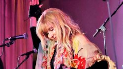 Lisa McCormick portraying Stevie Nicks